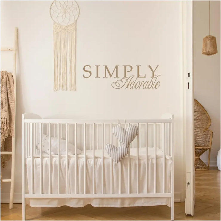 Simply Adorable vinyl wall decal over a beautiful bohemian style nursery in gold vinyl supplied by The Simple Stencil
