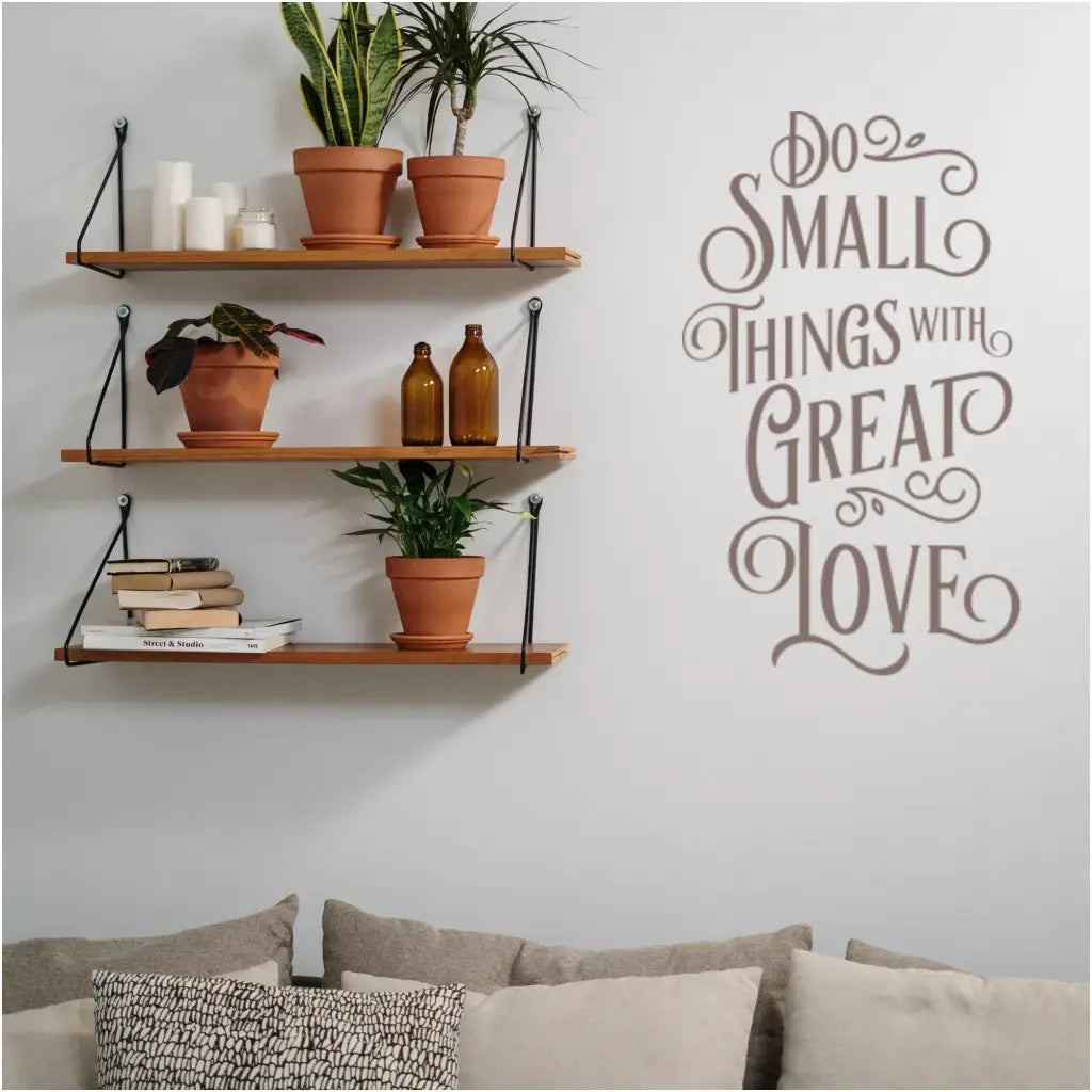 A beautifully designed vinyl wall decal displaying the motivational quote 'Do Small Things with Great Love' in a stylish home decor setting. Wall decal showing in matte brown by The Simple Stencil.