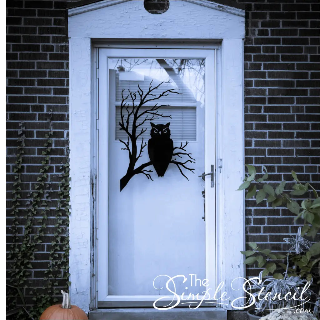 Spooky owl wall decal alongside other Halloween decorations, showcasing its versatility in complementing various spooky themes.