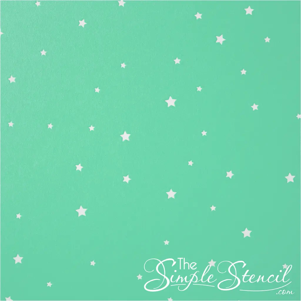 Collection of small white star decals on a green wall