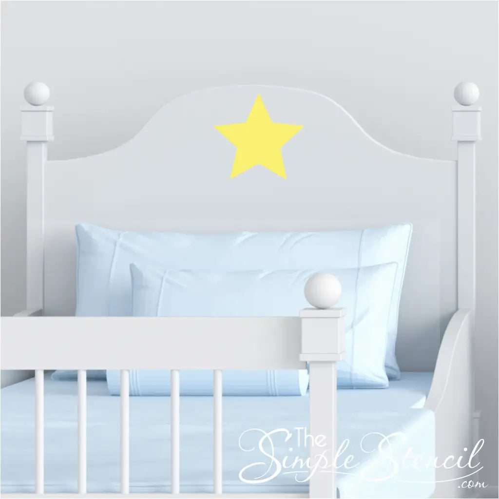 Peel and stick yellow star decal on a boys bed furniture