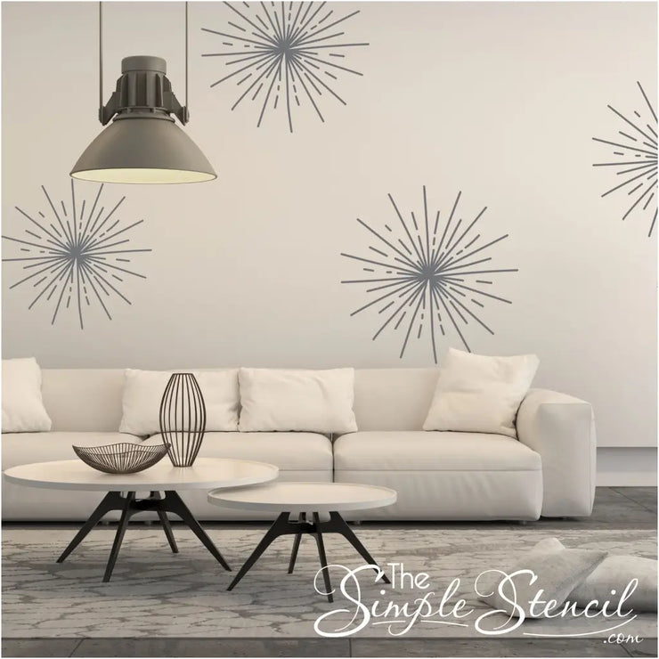 Large gray starburst precision cut decals add a modern flair to this monochrome living room wall. 