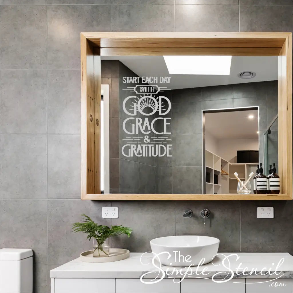 light grey "Start each day with God, Grace, and Gratitude" decal on a bathroom mirror