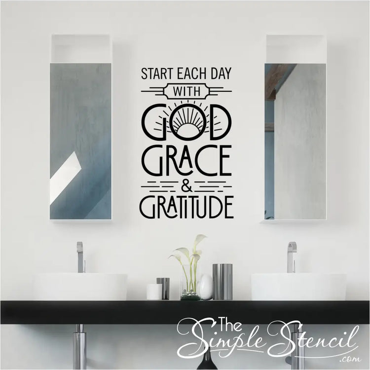 Inspirational wall decal with the quote "Start each day with God, Grace, and Gratitude" on bathroom wall