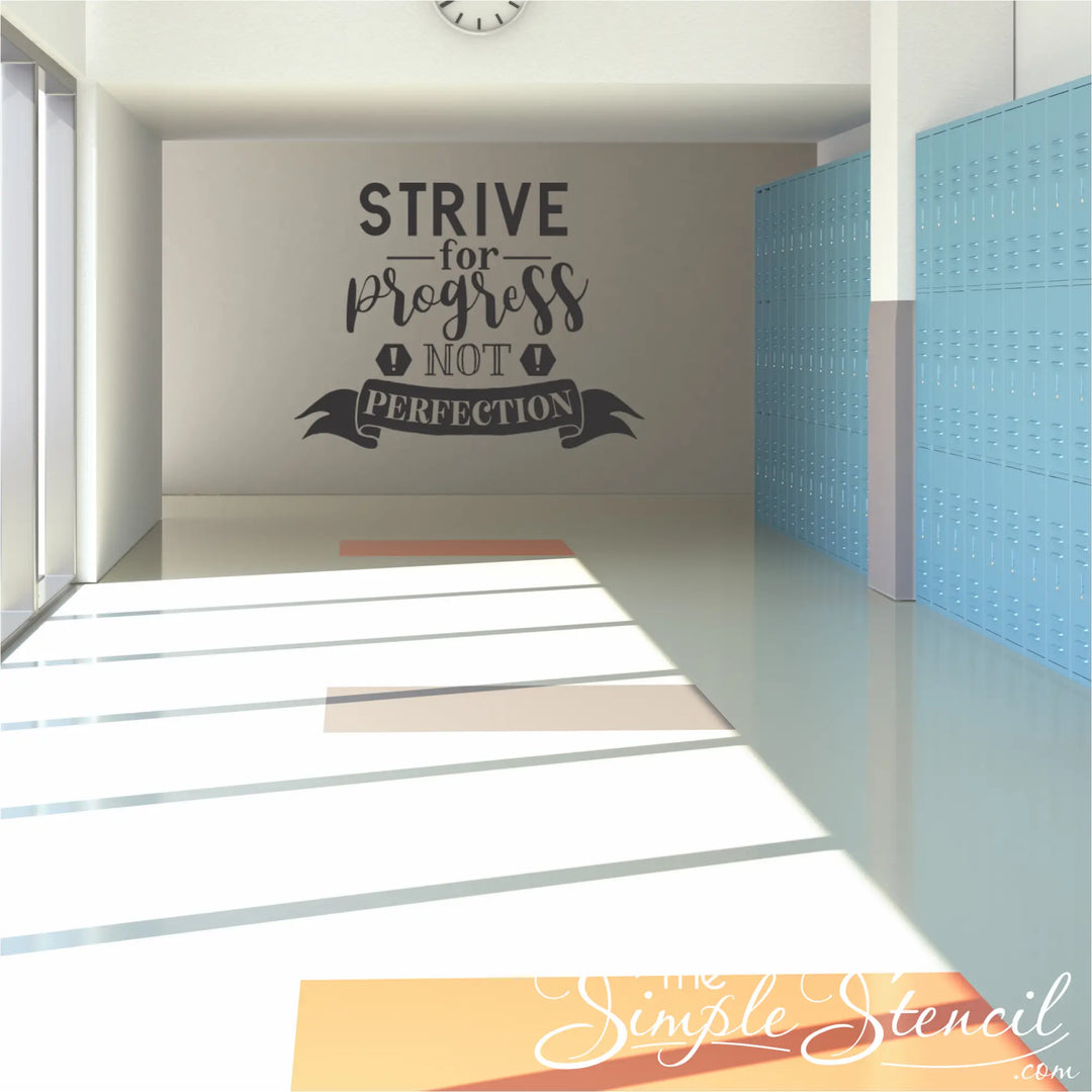 Motivational quote on a wall in a modern school hallway with blue walls and sunlight streaming in.