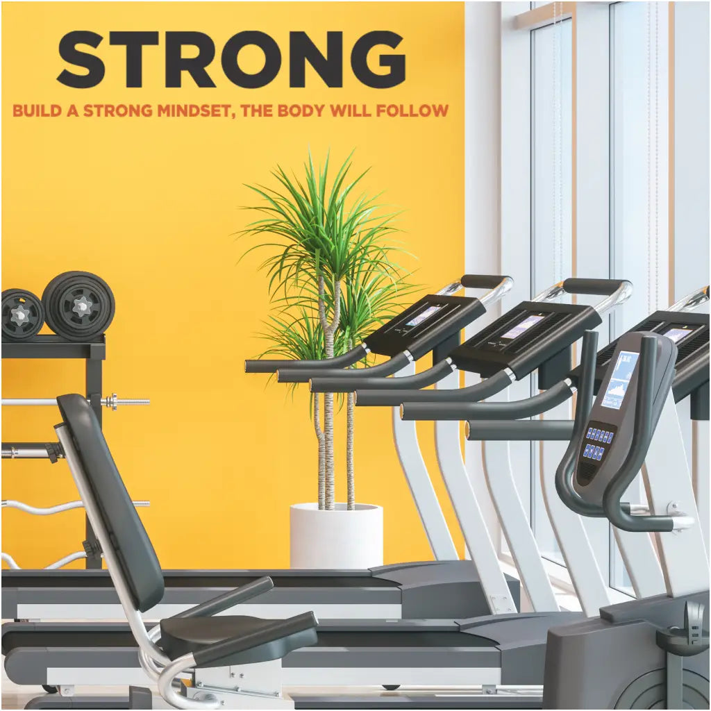 A large vinyl wall decal by The Simple Stencil for a fitness center gym wall that reads STRONG - build a strong mindset, the body will follow.