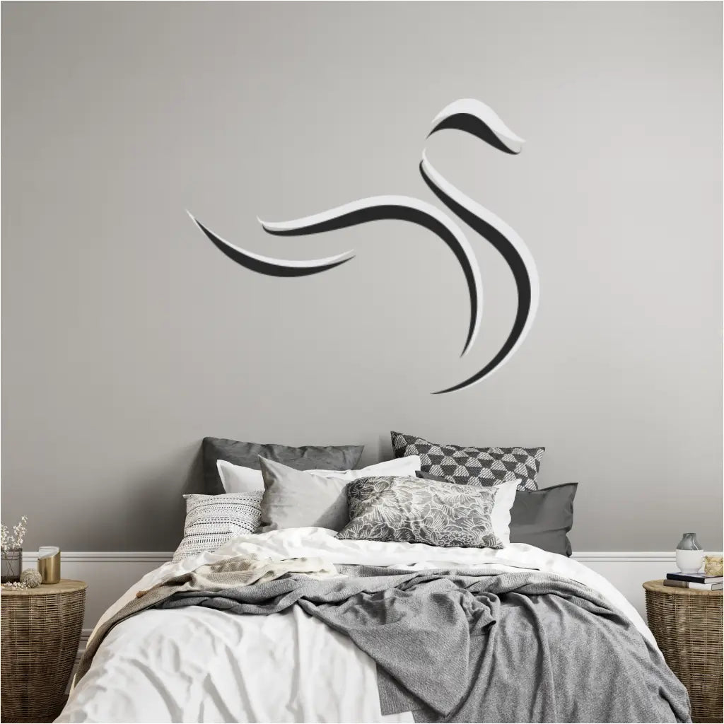 Graceful line art flourish swan wall decals in white and black facing right on a plain wall.