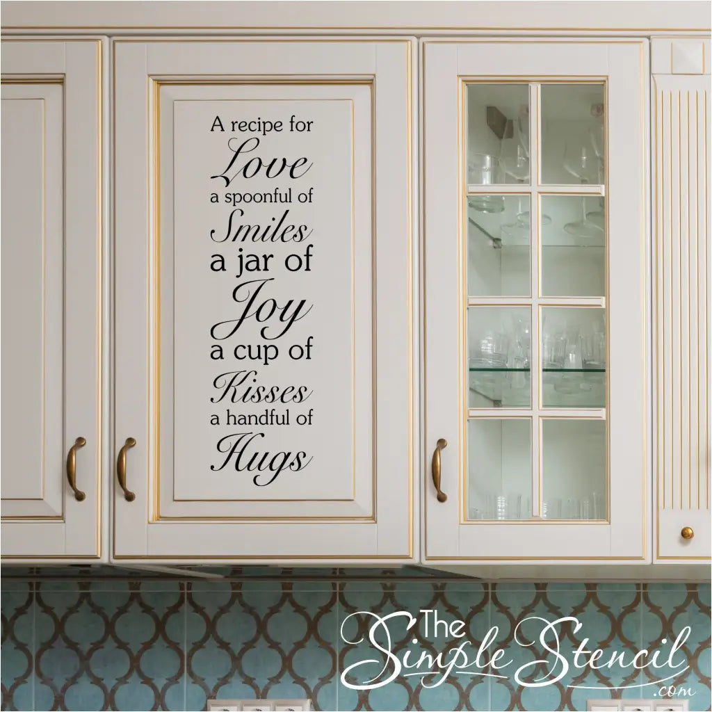"Recipe for Love" wall decal displayed vertically on a kitchen cabinet door.