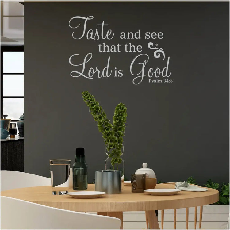 A beautiful wall decal for your Christian home shown on a dining room wall that reads: Taste and see that the Lord is Good. Pslam 34:8