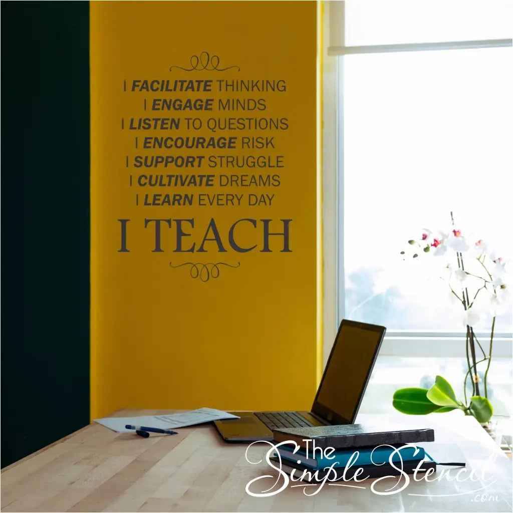 A colorful "I Teach" inspirational wall decal displayed on a teacher's office wall with a desk and comfortable chair.  By The Simple Stencil