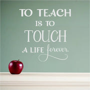 A beautiful wall decal gift idea for a teacher to decorate her classroom, teacher's lounge, etc. Reads: To teach is to touch a life forever. By TheSimpleStencil.com