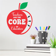 A school wall decal graphic of an Apple with the inscription that reads: Teachers are the CORE of Education and makes a lovely gift for a teacher during Teacher's Appreciation Week or as decor in the Teacher's Lounge. By TheSimpleStencil.com