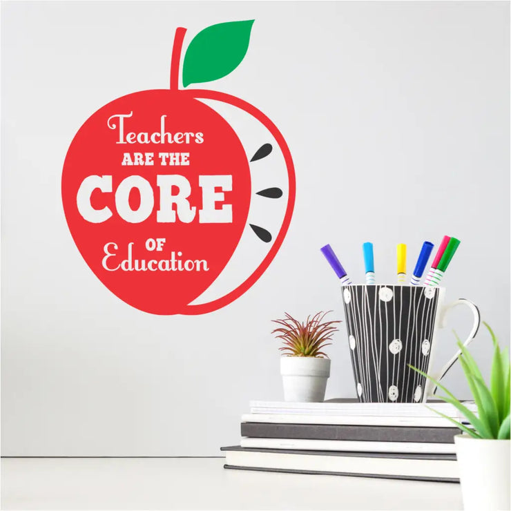 A school wall decal graphic of an Apple with the inscription that reads: Teachers are the CORE of Education and makes a lovely gift for a teacher during Teacher&