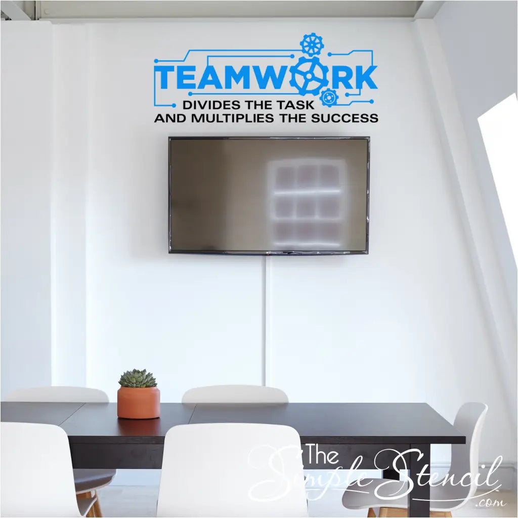 Teamwork Wall Quote Graphic decal shown on a school classroom wall  and reads: Teamwork divides the task and multiplies the success. By The Simple Stencil
