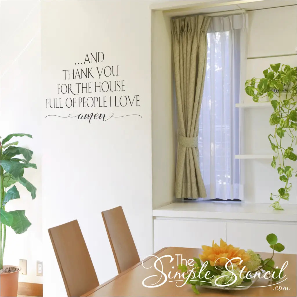 A dining room with the wall decal displayed prominently above a table, adding a touch of faith and gratitude to the space.