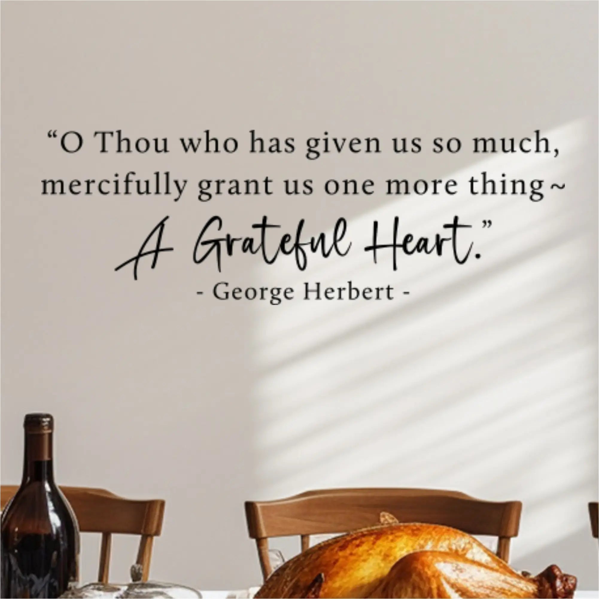 The "A Grateful Heart" prayer decal on a wall behind a dining table set with a roasted Thanksgiving turkey.