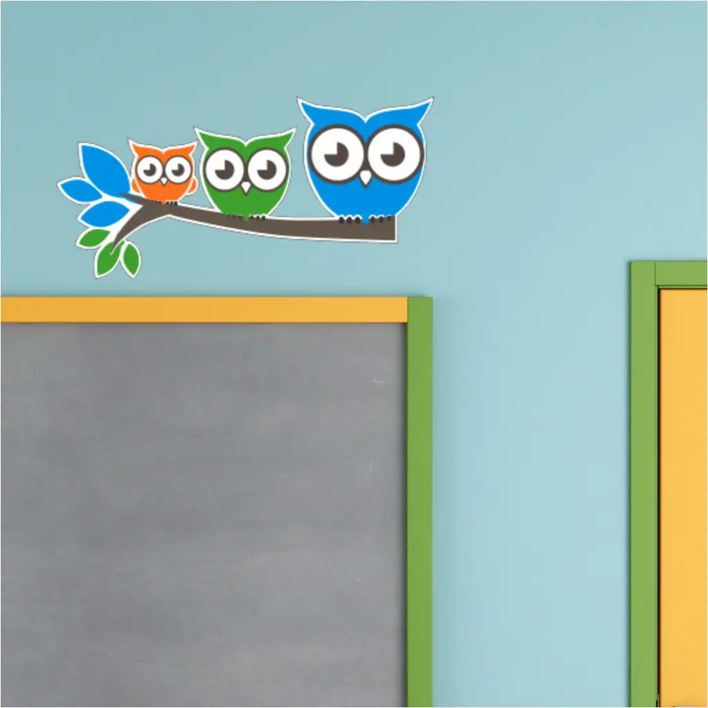 Three Happy Owls Wall Decal Sets decorating a classroom wall, by The Simple Stencil