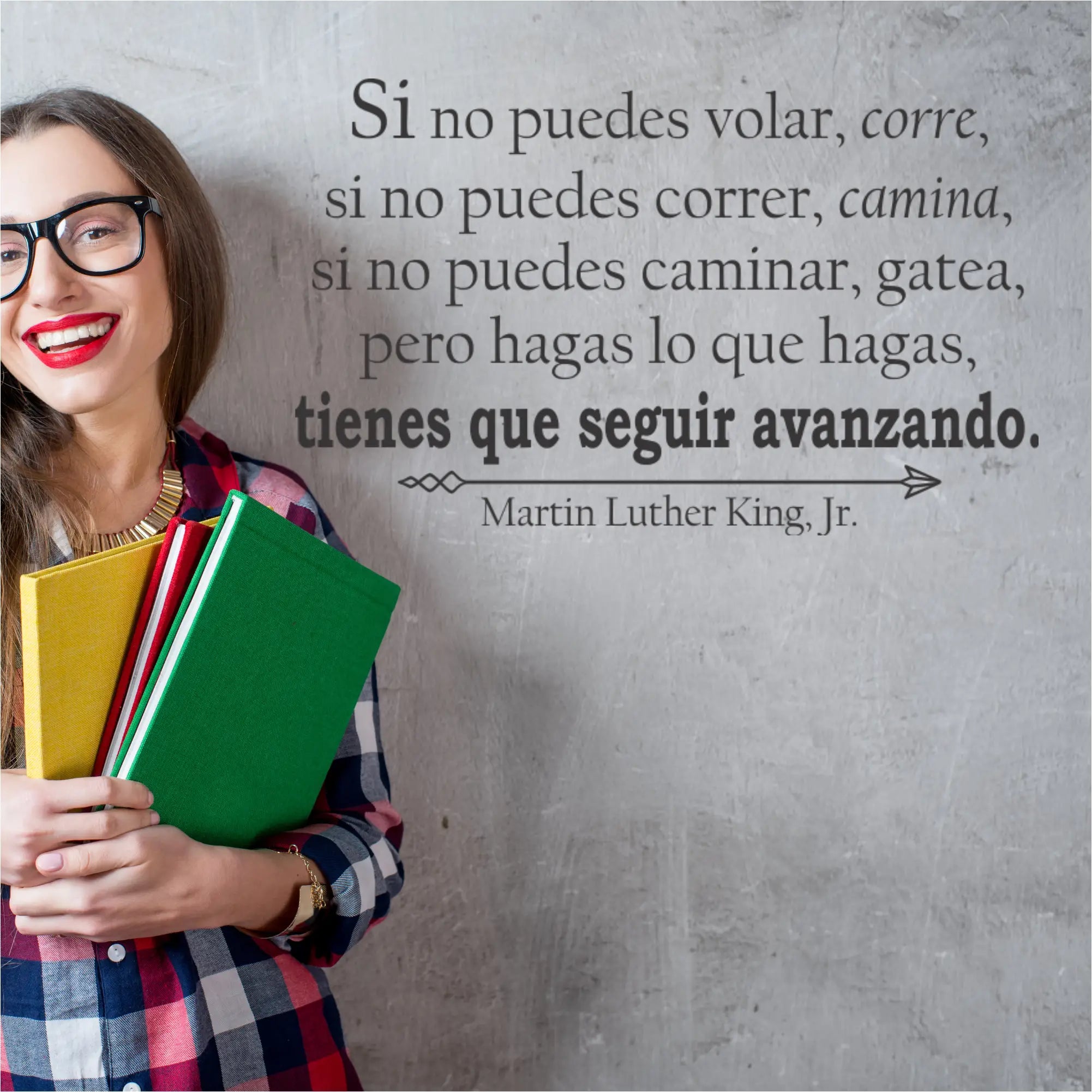 A woman with glasses holds colorful folders beside a martin luther king inspired keeps moving forward decal
