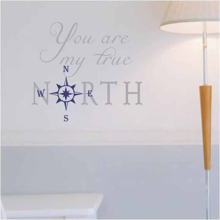 You are my true north. A vinyl wall decal shown in gray and navy blue on a pretty white wall. Easy to apply, looks painted on but removable when ready. 