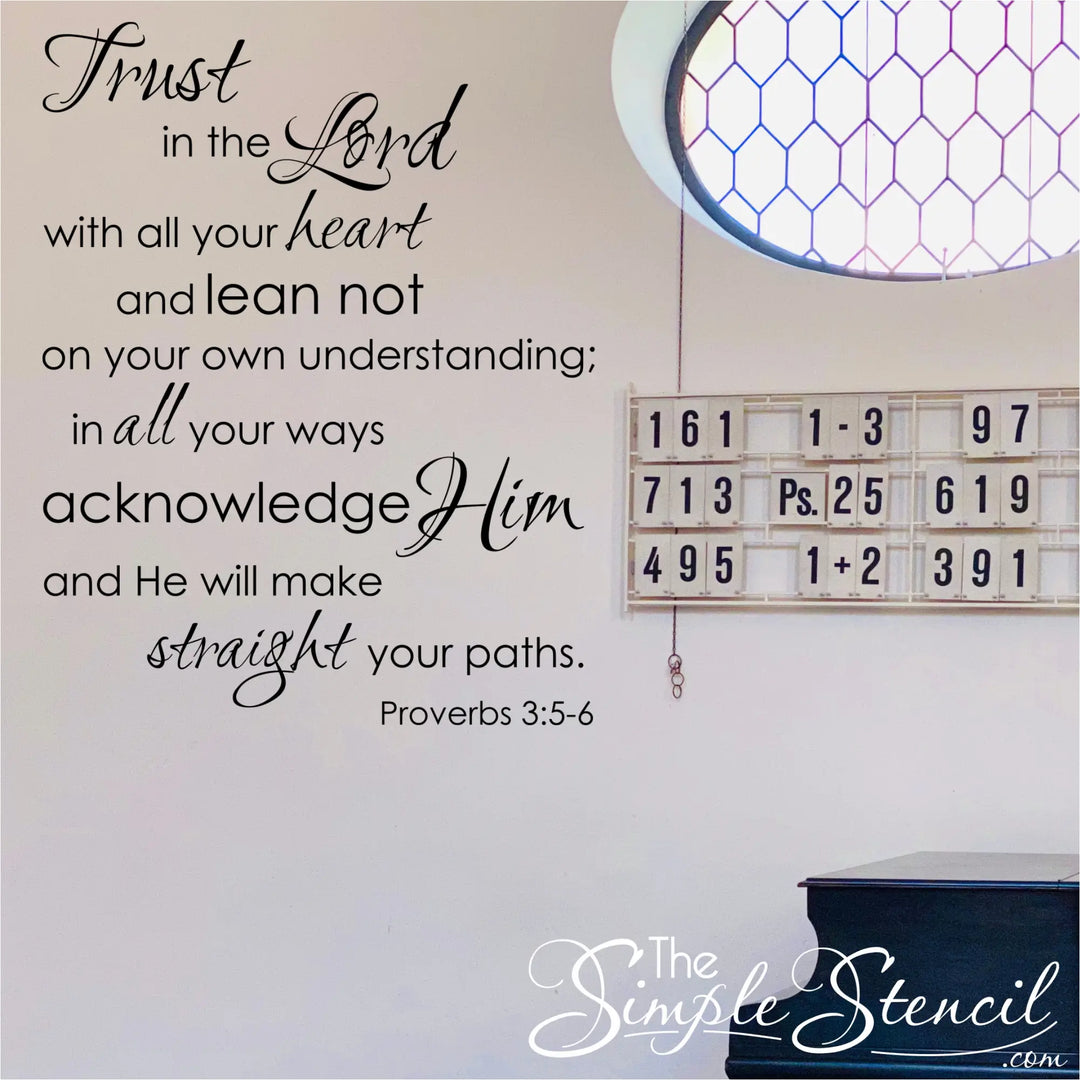 The bible verse wall sticker by The Simple Stencil shown on a church wall near the hymnal display that reads: Trust in the Lord with all thine heart and lean not on your own understanding; in all your ways acknowledge Him and He will make straight your paths. Proverbs 3:5-6