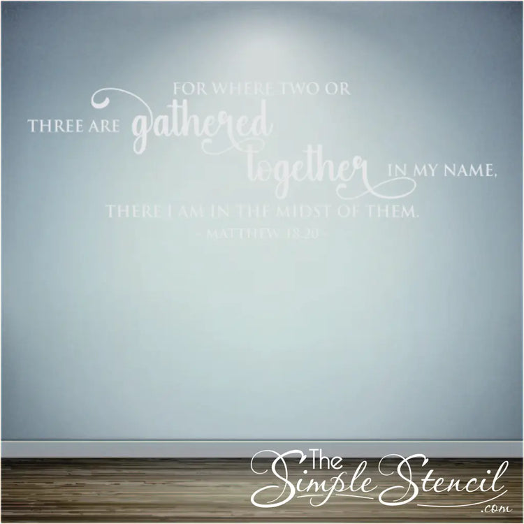 Large "Where two or three are gathered" vinyl wall art on a church wall.