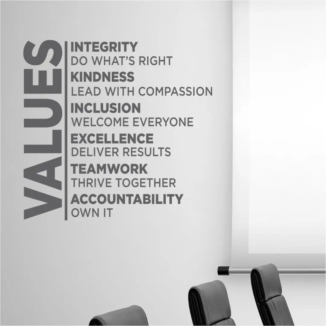 Gray values wall decal with bold sans-serif text promoting corporate principles like integrity for positive workspaces