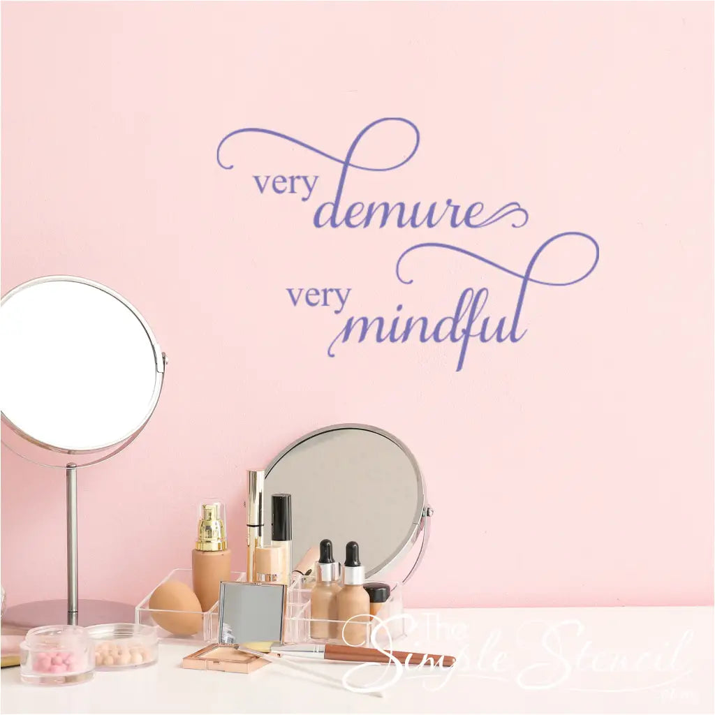 Purple "Very Demure Very Mindful" decal on a pastel pink wall, creating a soft, feminine vibe.