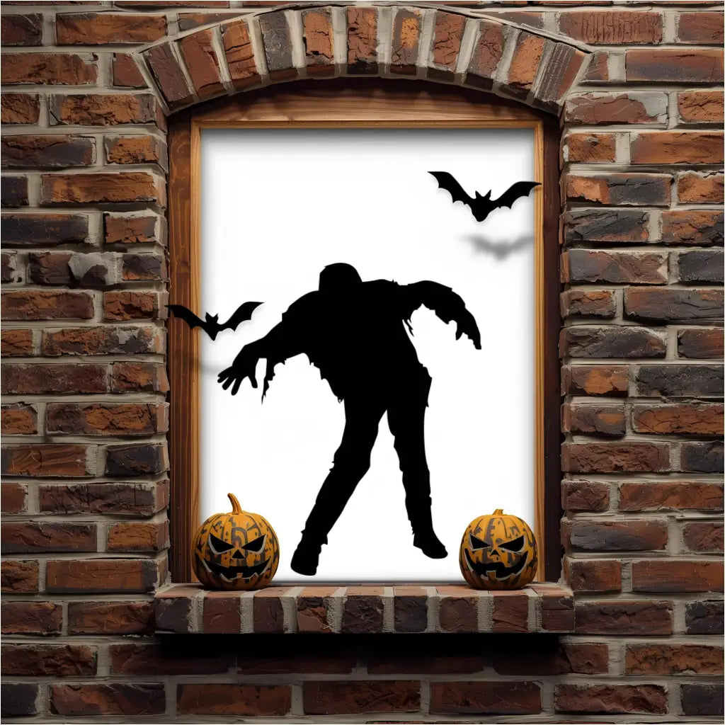A black walking zombie silhouette vinyl decal in a brick archway window, with two carved pumpkins and bats, creating a classic spooky Halloween scene.
