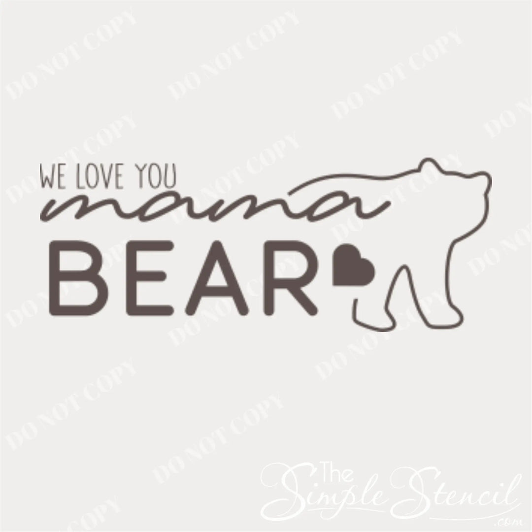 Close-up of the "We Love You Mama Bear" wall decal in vinyl, highlighting the playful font, bear outline and hearts in the design.