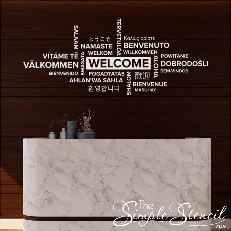 A close-up, high-resolution image showcasing a 'Welcome' wall decal with the word written in a plethora of different languages. This design is intended for a public place like an airport, train station, or public transit with a diverse population.