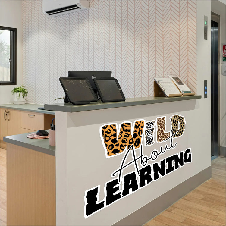 Wild about learning wall decal with leopard print and zebra stripes for vibrant classroom decor with animal prints